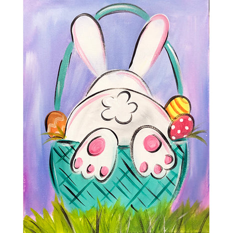 Canvas painting of an Easter bunny in a basket. His back legs and tail are sticking out of the basket.