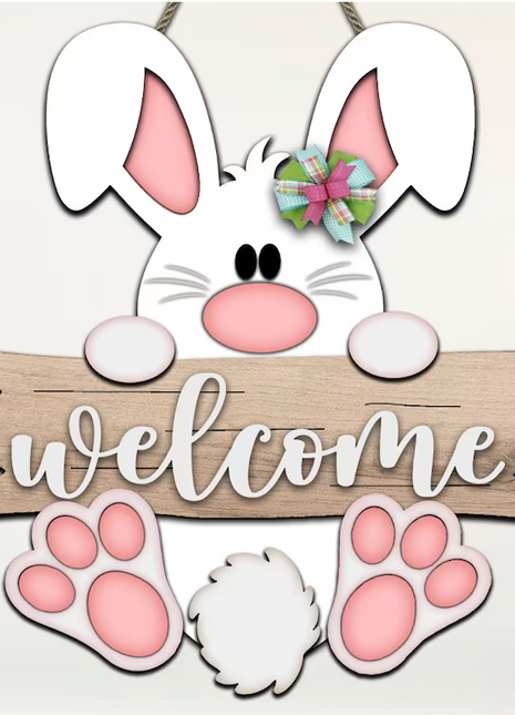 Easter bunny wood door hanger holding a brown wooden horizontal Welcome sign. Bunny is white with pink ears and pink paws. He has a fuzzy white tail. 