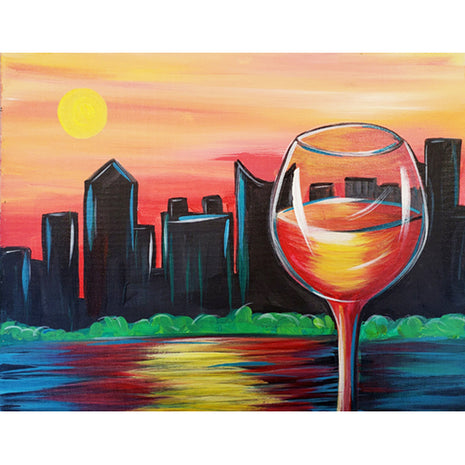 Canvas painting of a city skyline silhouetted in black against a sunset of orange and yellow and red. In the foreground is a large wine glass with the sunset colors reflected in it. 